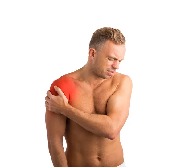 Man with shoulder pain holding his hand to it — Stock Photo, Image