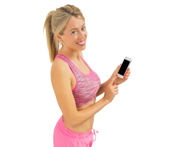 Aktive Frau nutzt Smartphone beim Training — Stockfoto