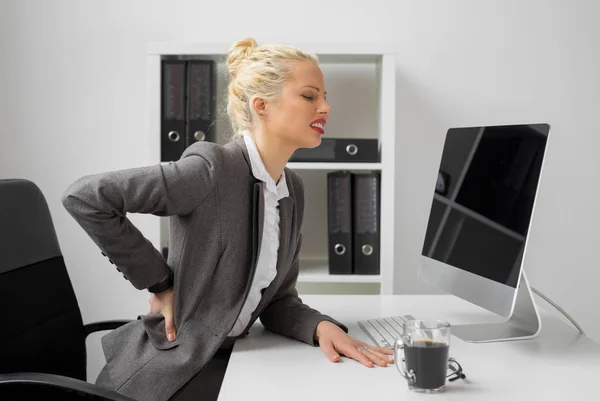 Worker at the office with terrible back pain — Stock Photo, Image