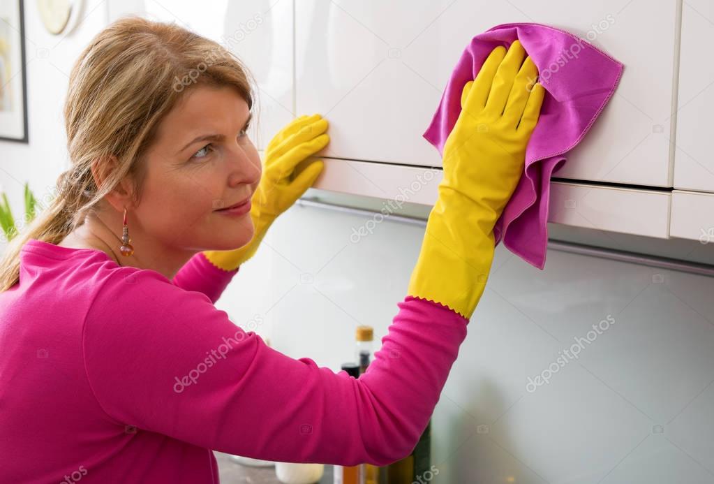Person cleaning and dusting