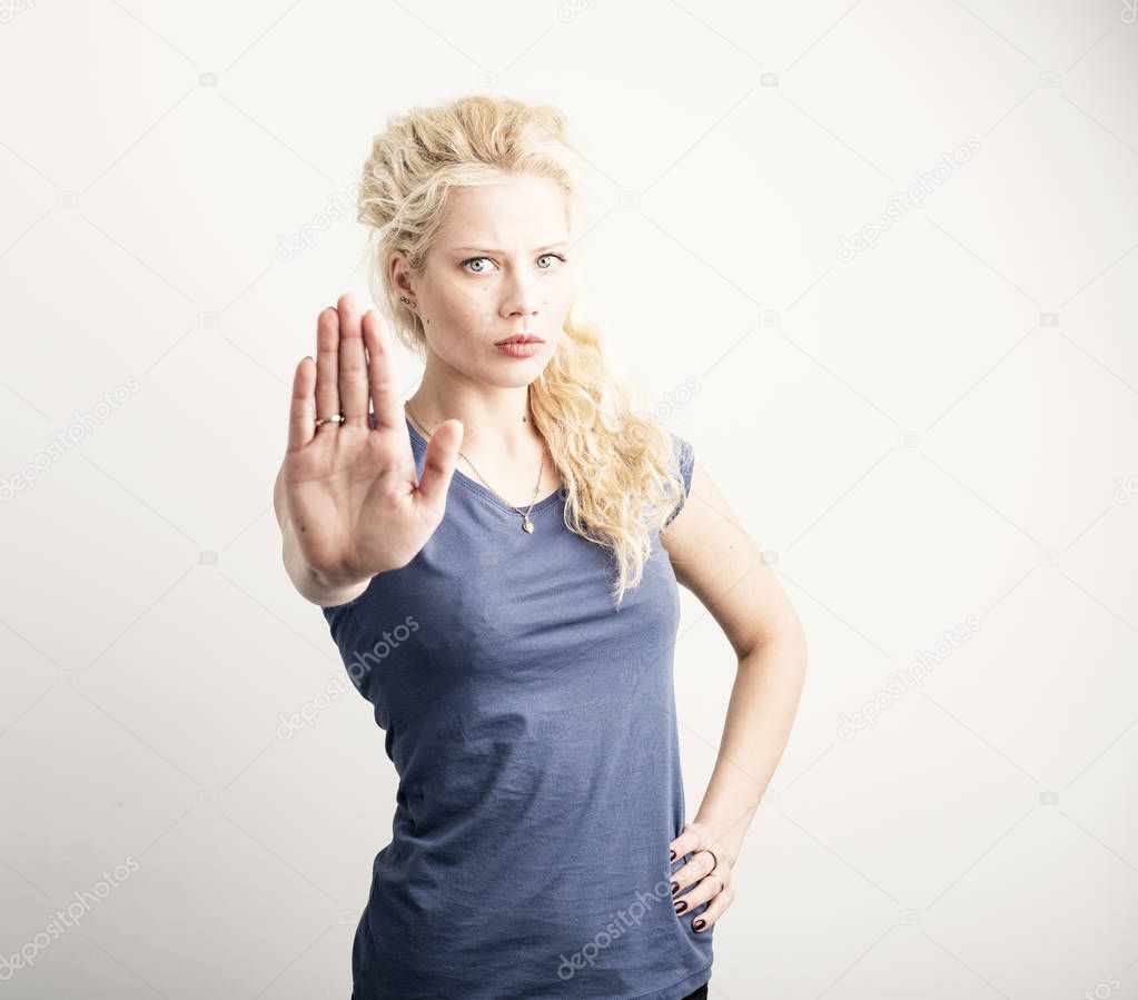 Woman showing stop sign with her hand