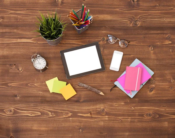 Tablet computer and office supplies on wooden background — Stock Photo, Image