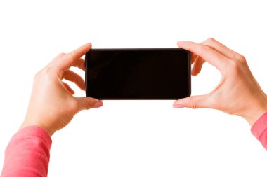 El ele tutuşan akıllı telefon ve fotoğraf çeken ya da video çeken kişi, beyaz arkaplanda izole edilmiş fotoğraf