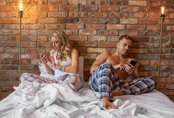 Woman Man Using Each Own Mobile Phones Bed — Stock Photo, Image