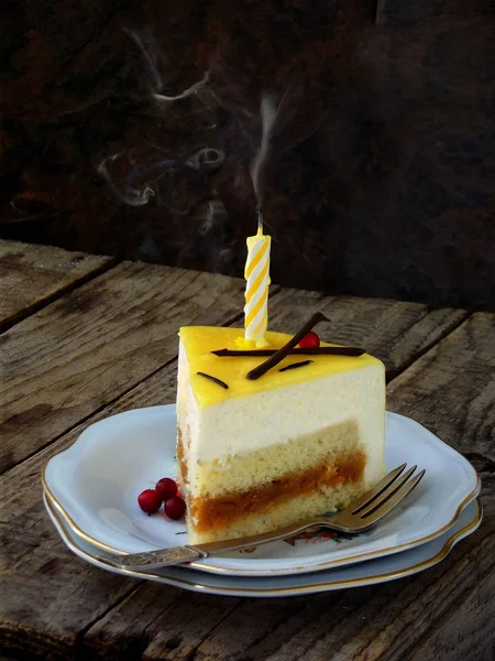 Piece of cake and extinguished candle. Niigata cake. holiday is over. Copy space. — Stock Photo, Image