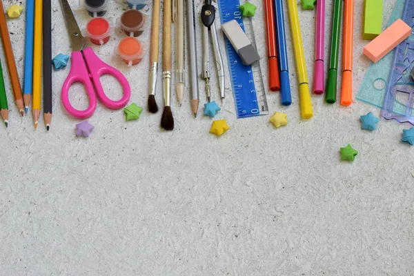 Frame of School accessories and supplies: pencils, markers, paints, pens on a light background. Back to school. View from above. Flat lay — Stock Photo, Image