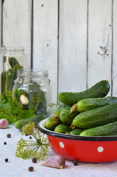 stock image Preservation of pickling cucumber. Preparation of conservation from organic vegetables on a light background. Homemade organic crunch green pickles in a jar. Copy space