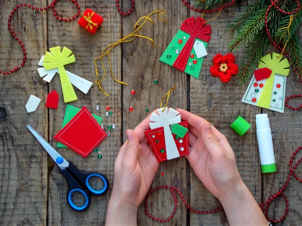 Making of handmade christmas toys from felt. Christmas card.