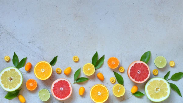 Set of citrus on light background: orange, mandarin, lemon, grapefruit, lime, kumquat, tangerine. Fresh organic juicy fruits. Source of vitamin C. Healthy food concept. Copy space — Stock Photo, Image