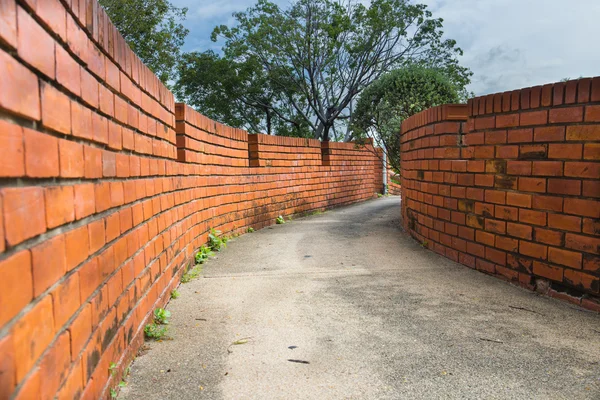 wall two side of narrow walkway between two buildings Two brick