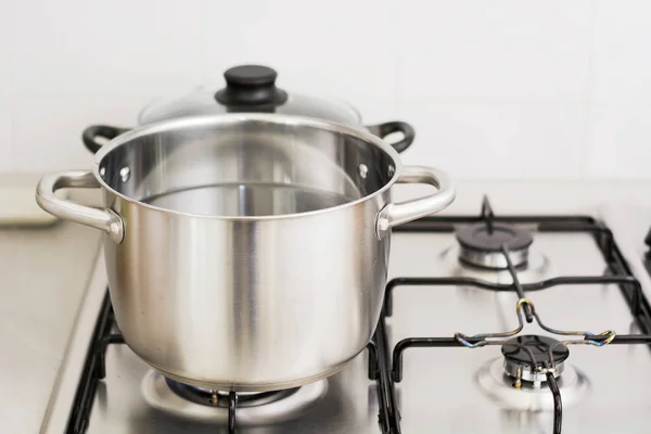 stainless steel cooking pot on gas stove