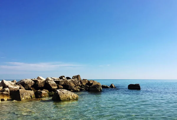 Rocky coastline in a summer day — Stock Photo, Image