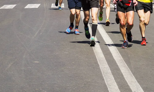 Detail of a group of runners during a city marathon