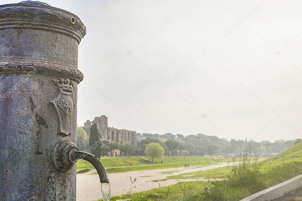 close-up view of a roman Nasone public drinking water fountain