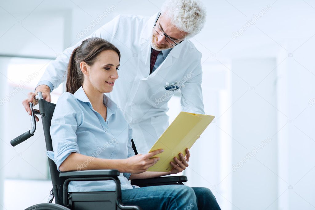 Doctor and patient examining medical records