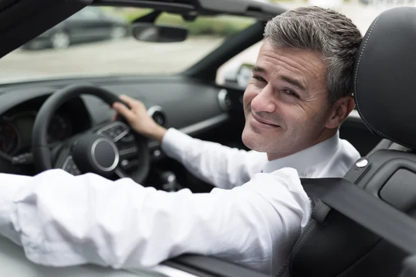 Successful businessman driving his car — Stock Photo, Image