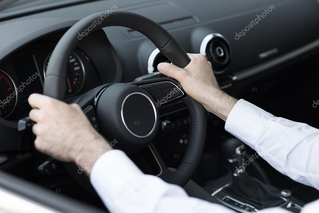 Businessman driving his car