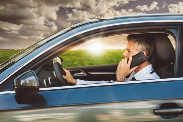 Busy manager on the car — Stock Photo, Image