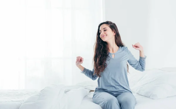 Girl waking up and stretching — Stock Photo, Image