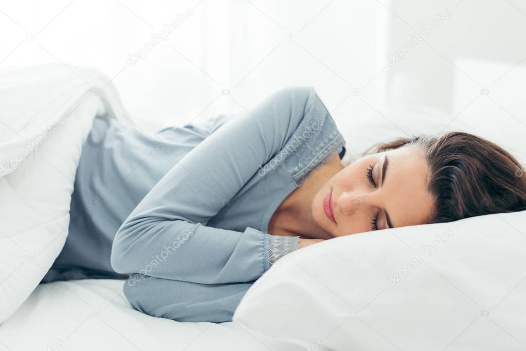 Girl sleeping in her bed