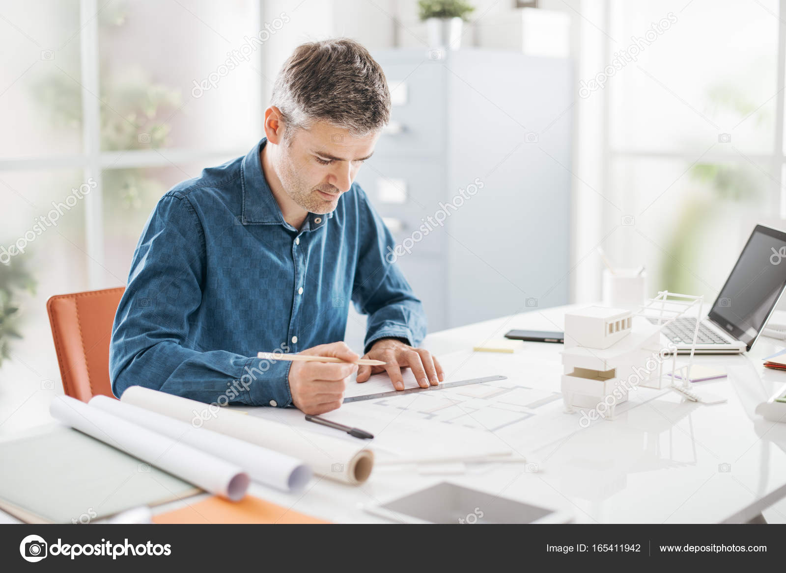 Architect working in his office Stock Photo by ©stockasso 165411942