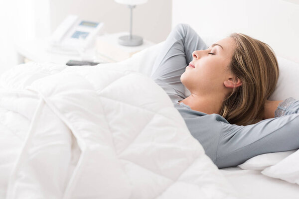 Young woman sleeping in the bedroom