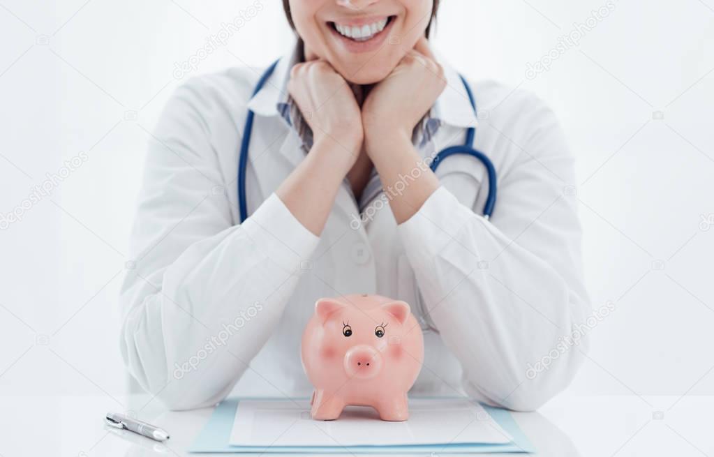 Female doctor and piggy bank: health insurance