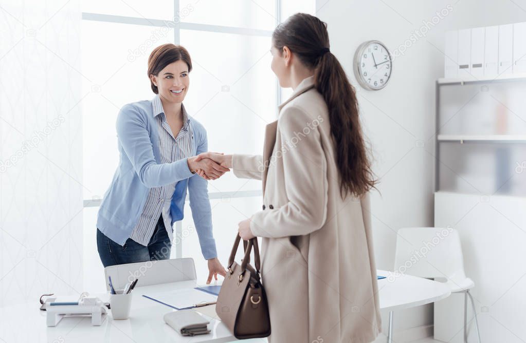 Businesswoman giving an handshake