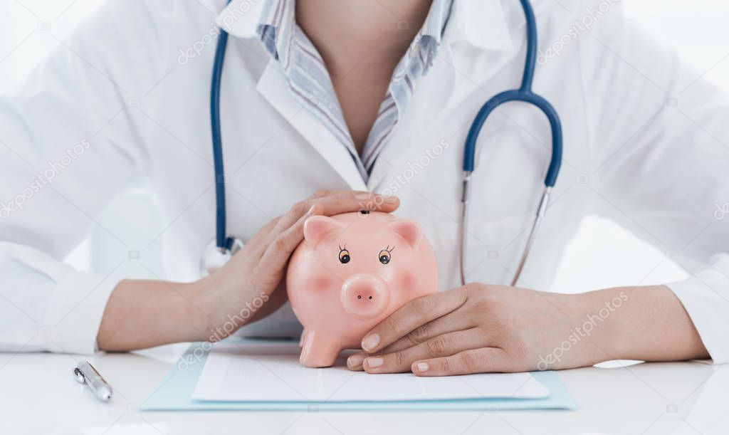 Female doctor and piggy bank: health insurance