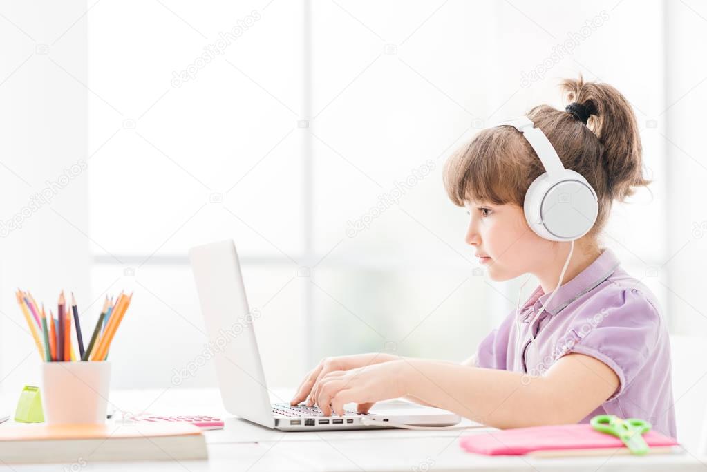 Smart girl connecting with a laptop