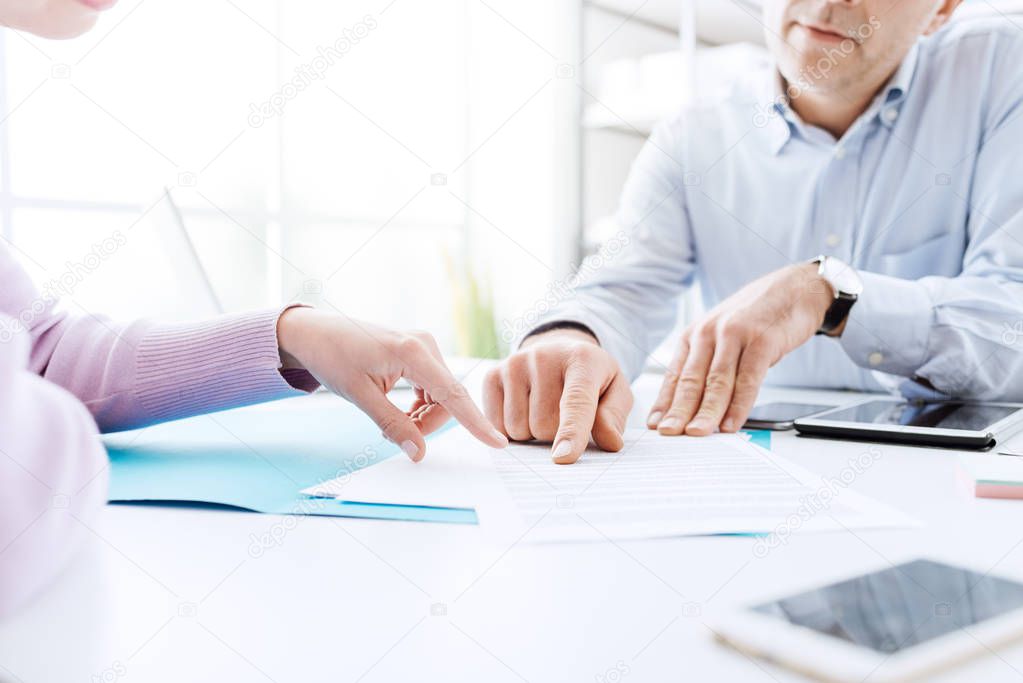 Business people negotiating a contract