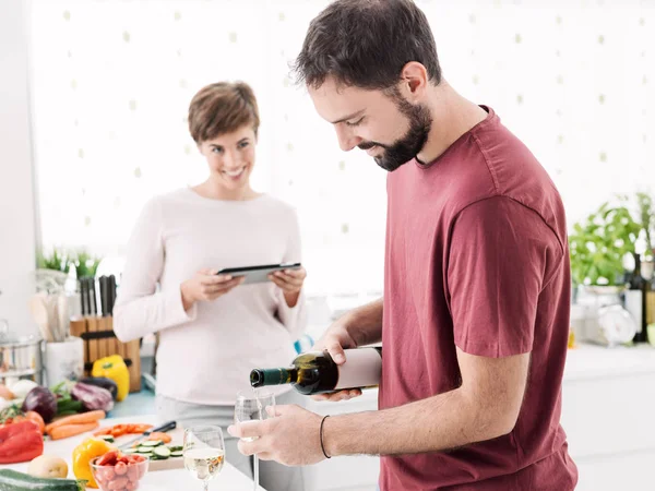 Couple in the kitchen having a drink — Stock Photo, Image