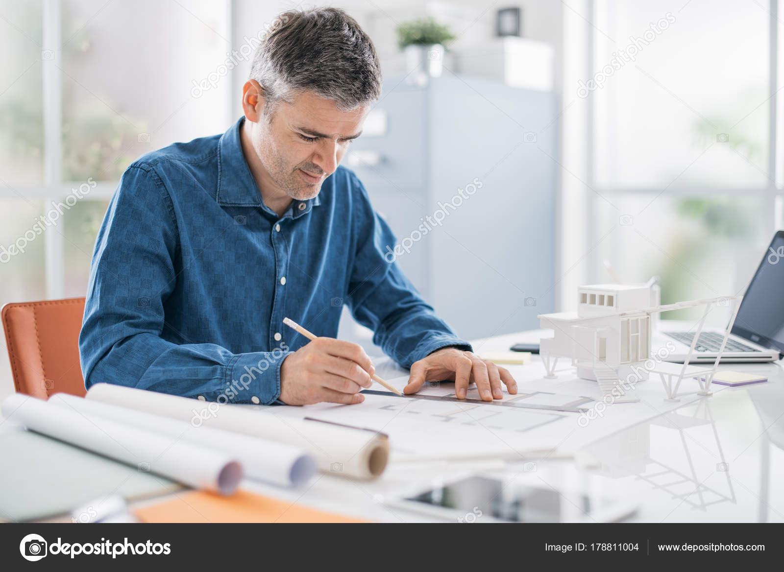 Architect working in his office Stock Photo by ©stockasso 178811004