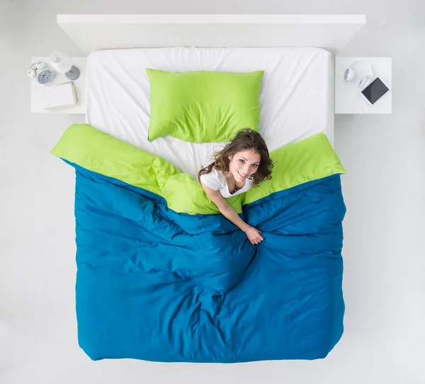 Woman waking up in her bed — Stock Photo, Image