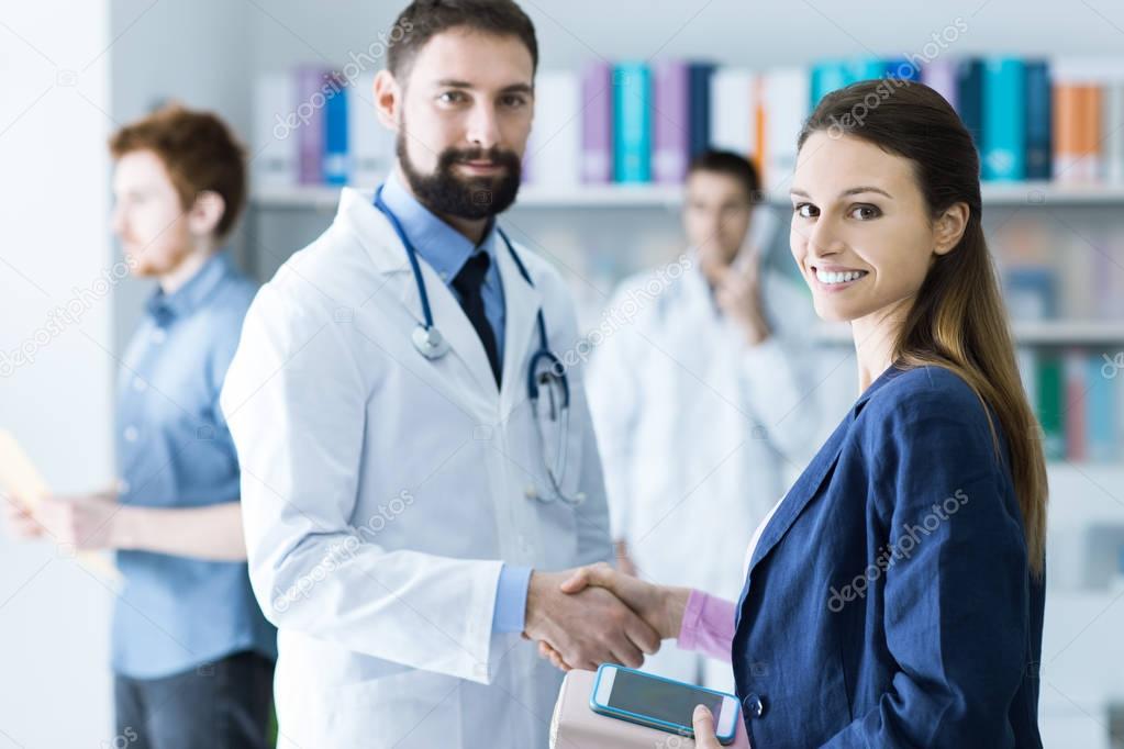 Patient and doctor shaking hands