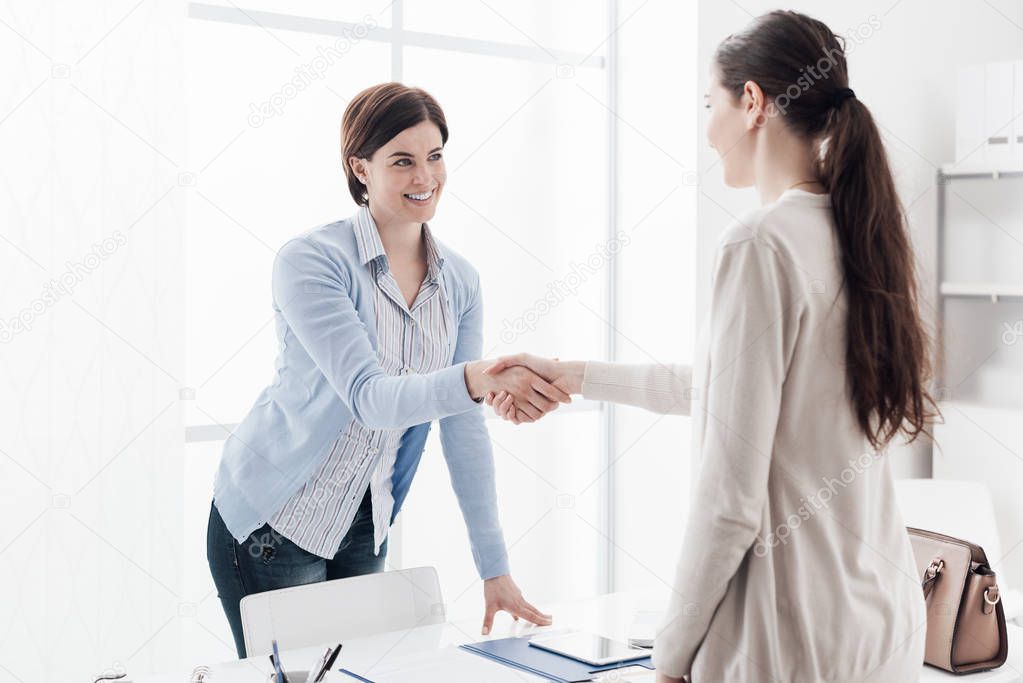 Businesswoman giving an handshake