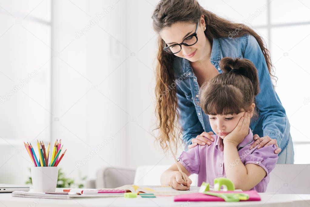 Mother and child doing homework together