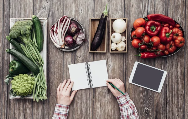 Cook writing down recipes