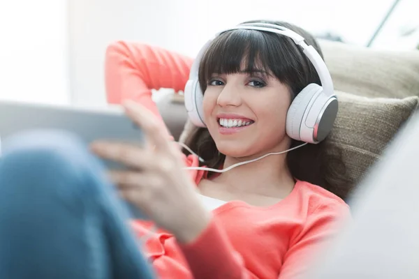 Smiling Young Woman Relaxing Home Couch She Wearing Headphones Using — Stock Photo, Image