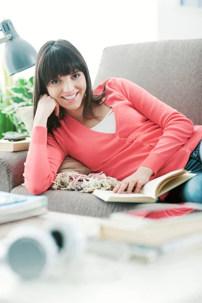 Beautiful Young Woman Relaxing Home Sofa Reading Book She Smiling — Stock Photo, Image