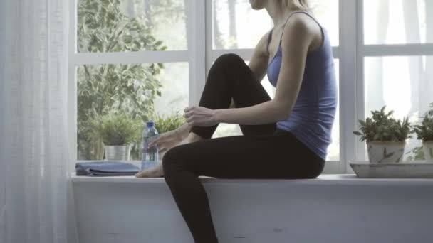 Woman exercising at home and having a break — Stock Video