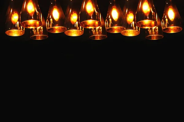 Row of light lamp on black background — Stock Photo, Image