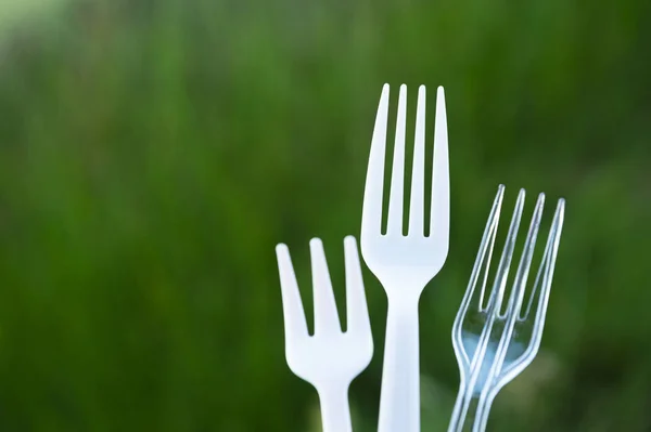 White disposable white fork in garbage environmental pollution p — Stock Photo, Image