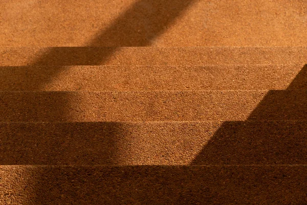Light and shadow on brown yellow stair architecture background — 스톡 사진