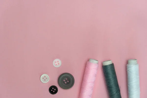 Pink grey white tread and button for sewing or embroidery on bac — 스톡 사진