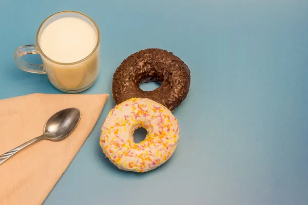 Donuts and milk on a blue background