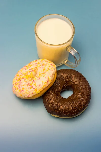 Donuts and milk on a blue background