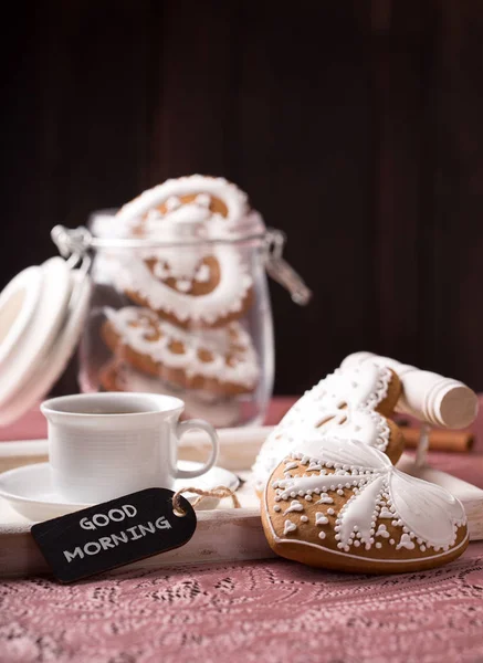 Beautiful decorated cookies with a cup of coffee — Stock Photo, Image