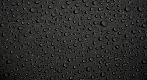 Waterdrops background black — Stock Photo, Image