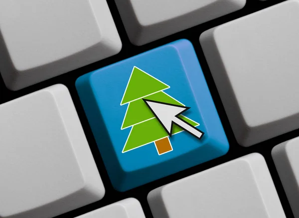 Símbolo del árbol de Navidad en teclado azul —  Fotos de Stock